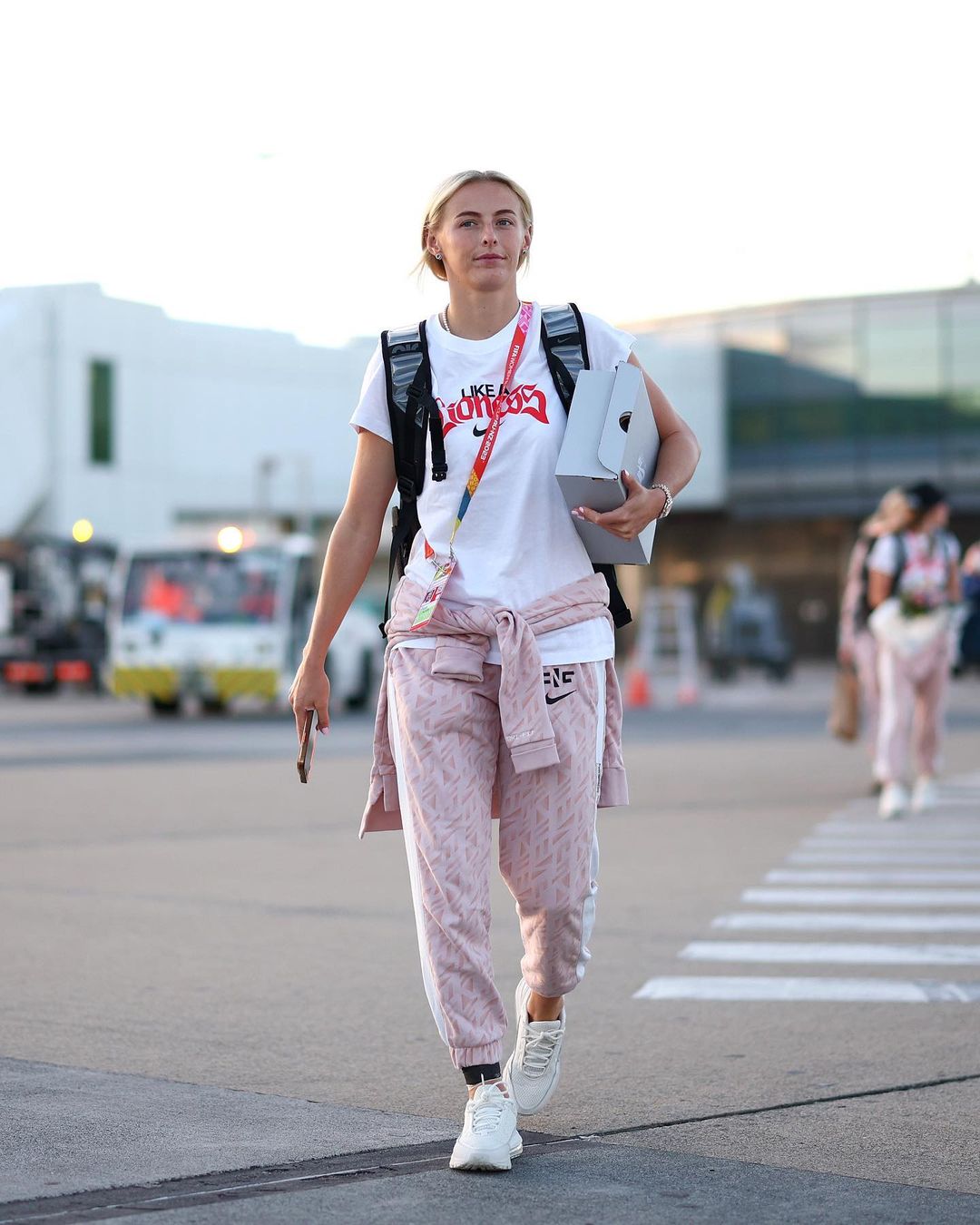 Chloe Kelly holding her custom Air Max Pulses from CANVVS