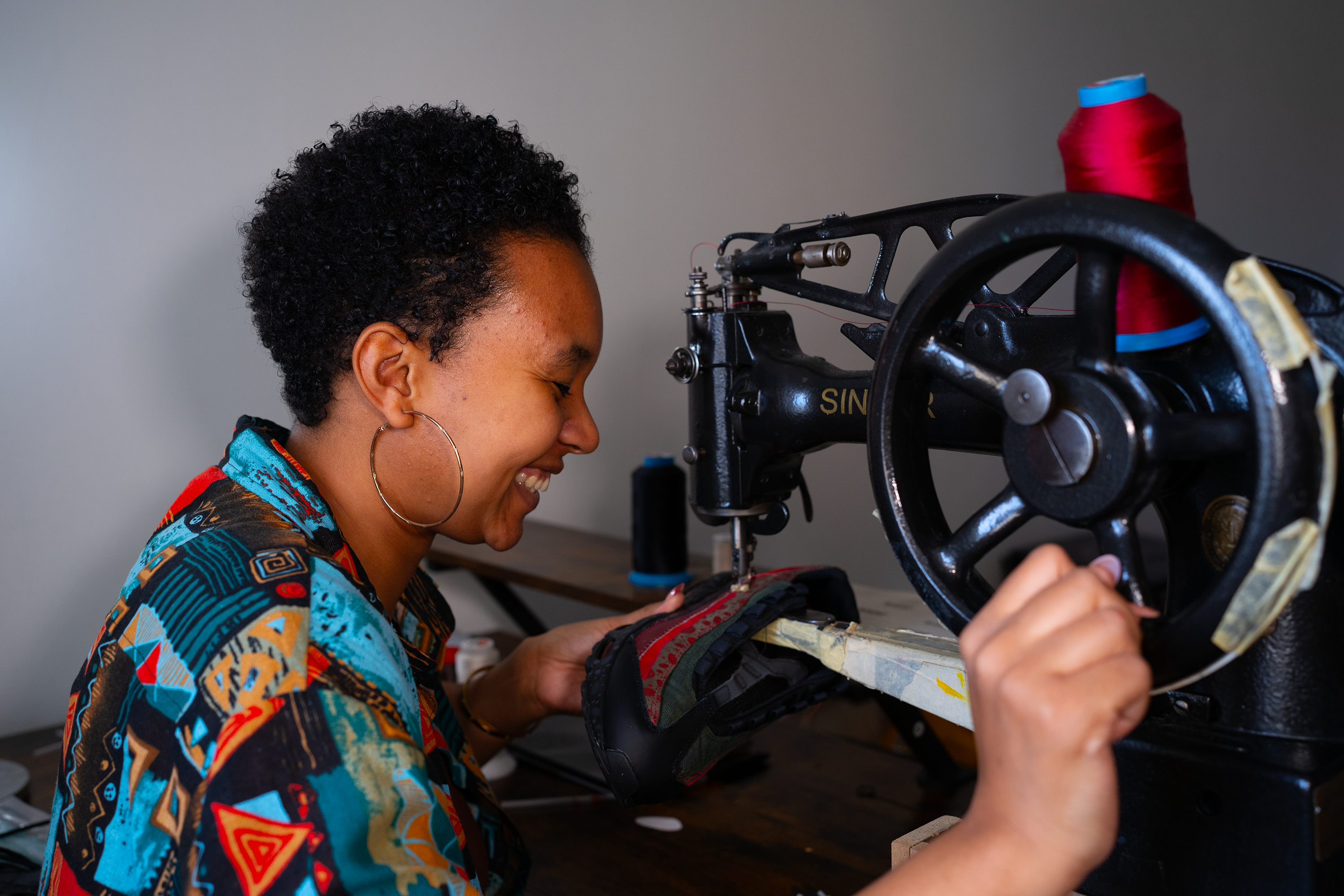 Afrokickz Custom Sneaker Artist working in studio creating custom Air Max 90 Sneakers