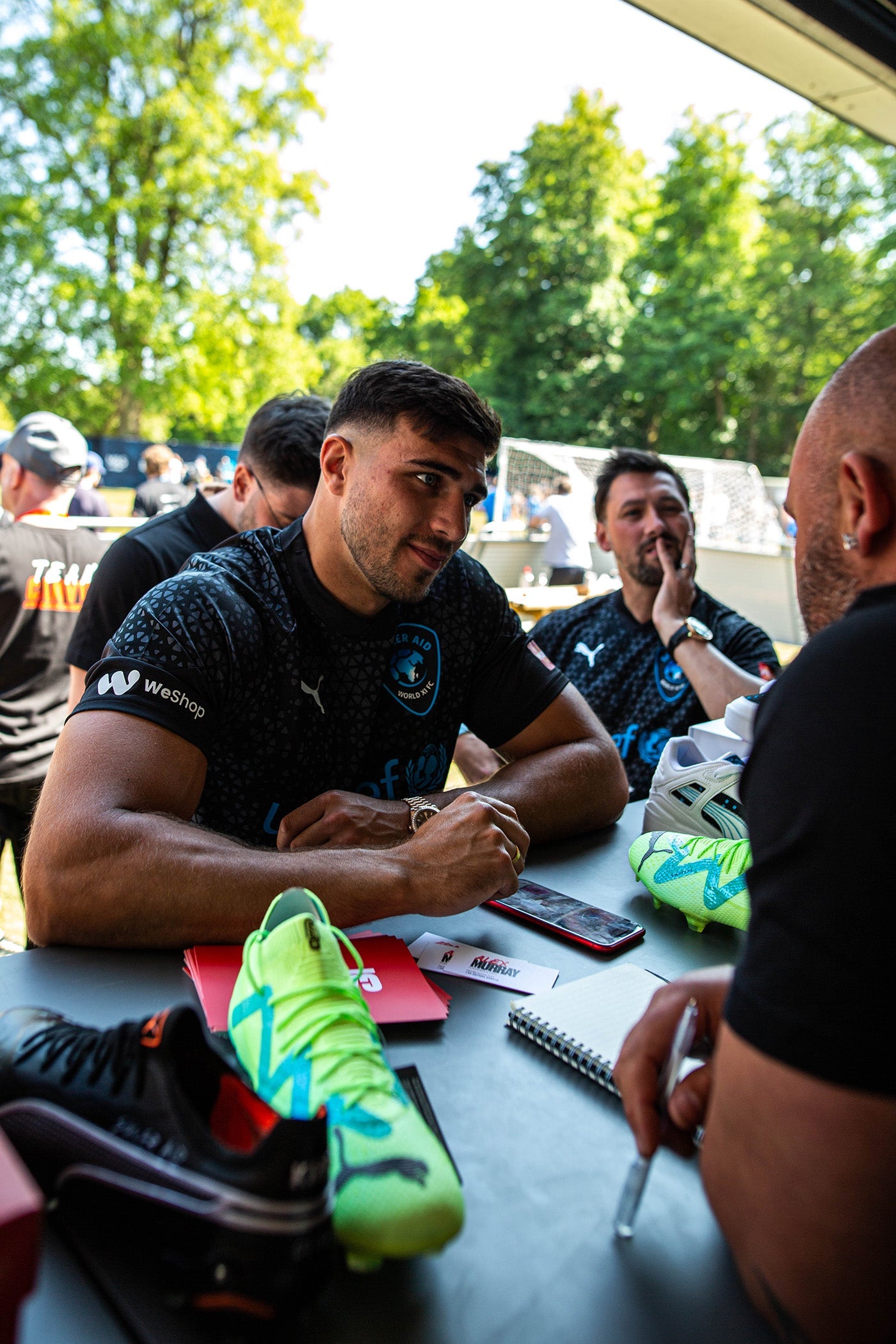 Boxer Tommy Fury Chooses sneaker customisation options at CANVVS Stand