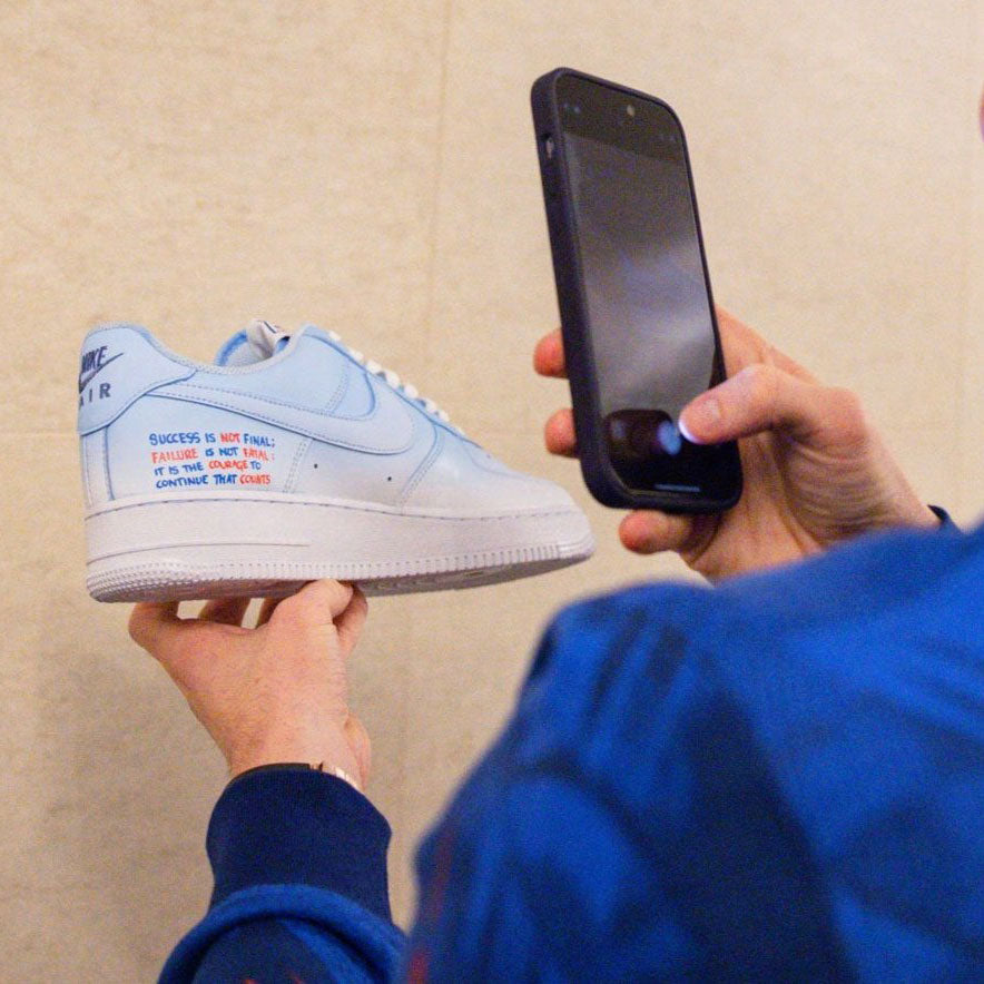 Player taking picture of Custom Air Force 1 Trainers for England World Cup